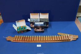 A leather shot gun cartridge belt with a quantity of 12 bore Cartridges.