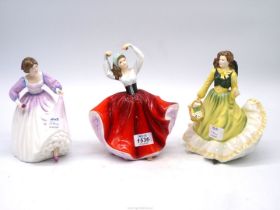 Three Royal Doulton figures 'April', 'Karen' and 'Ashley'.
