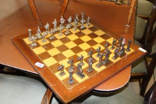 A Chess set (complete) with pieces in the form of the Roman Emperors/Gladiators, etc.