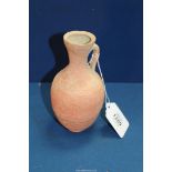 An early redware Roman jug, Republic period, cracks or repairs visible to the rim, 6 1/4'' high.