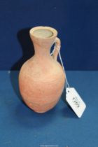 An early redware Roman jug, Republic period, cracks or repairs visible to the rim, 6 1/4'' high.
