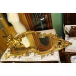 A large old Gesso and giltwood framed wall mirror with slight losses, 37" x 25" approx.