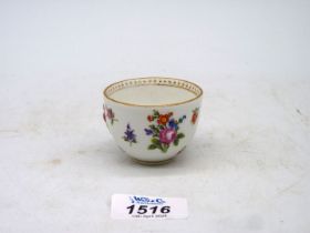 An early Meissen porcelain wine cup having 'in relief' floral decoration with crossed swords mark