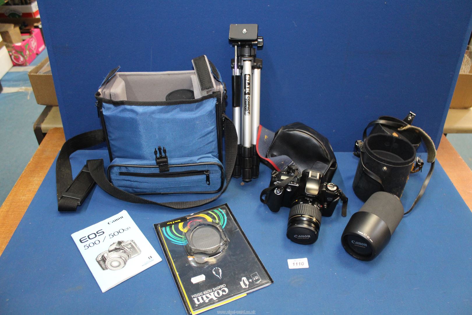 A Canon EOS 500 camera with ultrasonic lens, canon lens, tripod, etc.