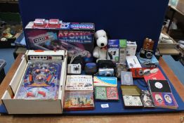 A quantity of miscellanea including small table top pinball arcade game, Winkles Wedding game cards,