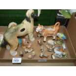 A quantity of ornaments including Coopercraft Afghan Hound, Jersey cow creamer etc.