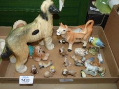 A quantity of ornaments including Coopercraft Afghan Hound, Jersey cow creamer etc.