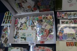 A box of stamps; loose and in packets, etc.