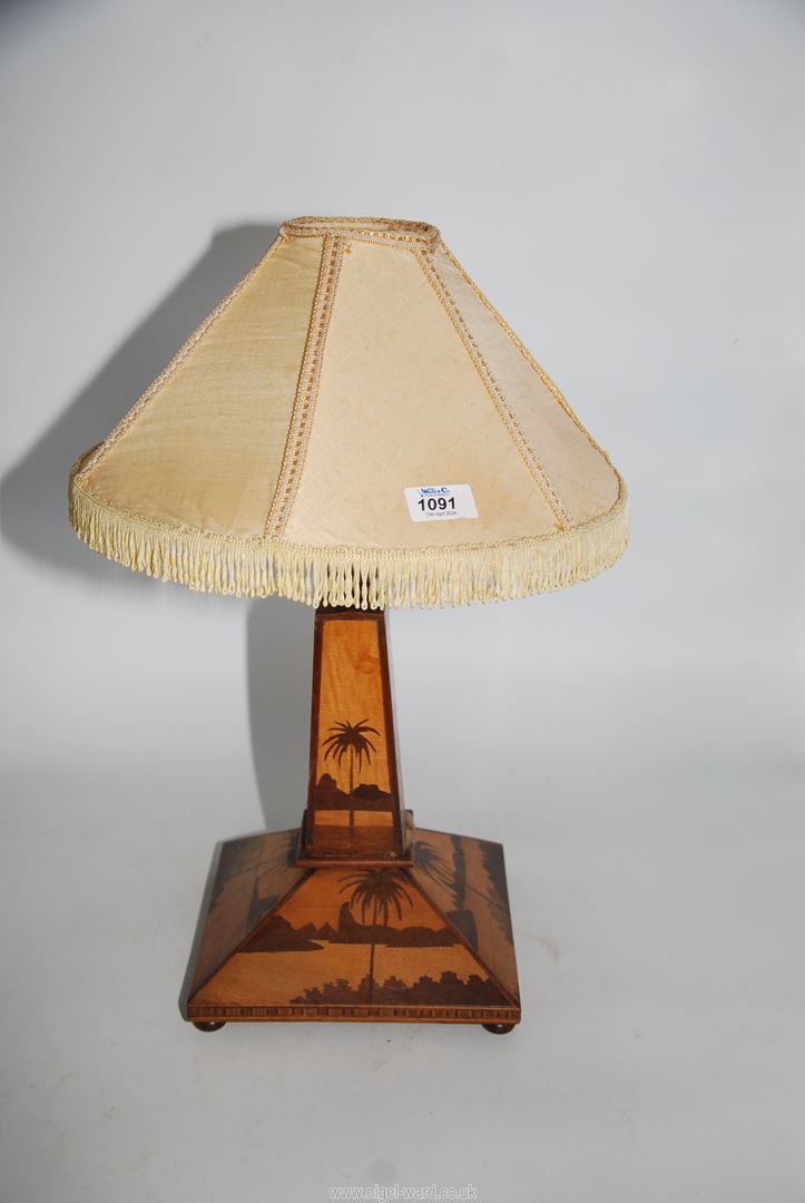 A vintage Treen table lamp with square base and tapering column with palm tree and lake marquetry