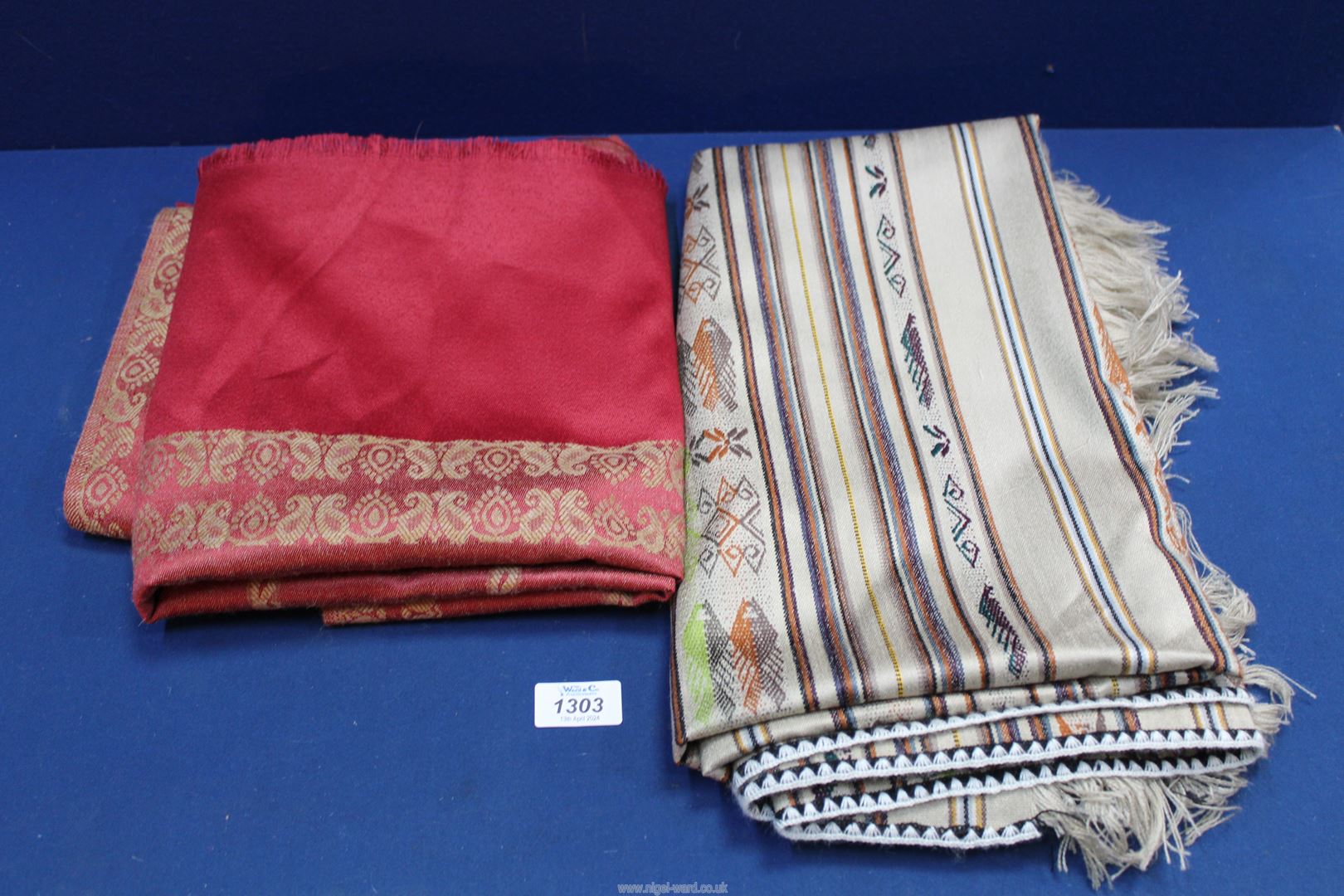 Two woven shawls or throws, possibly wool/silk, as new.