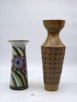 A tall Studio Pottery vase in hexagonal design (rim repaired) and a floral vase with brown interior.