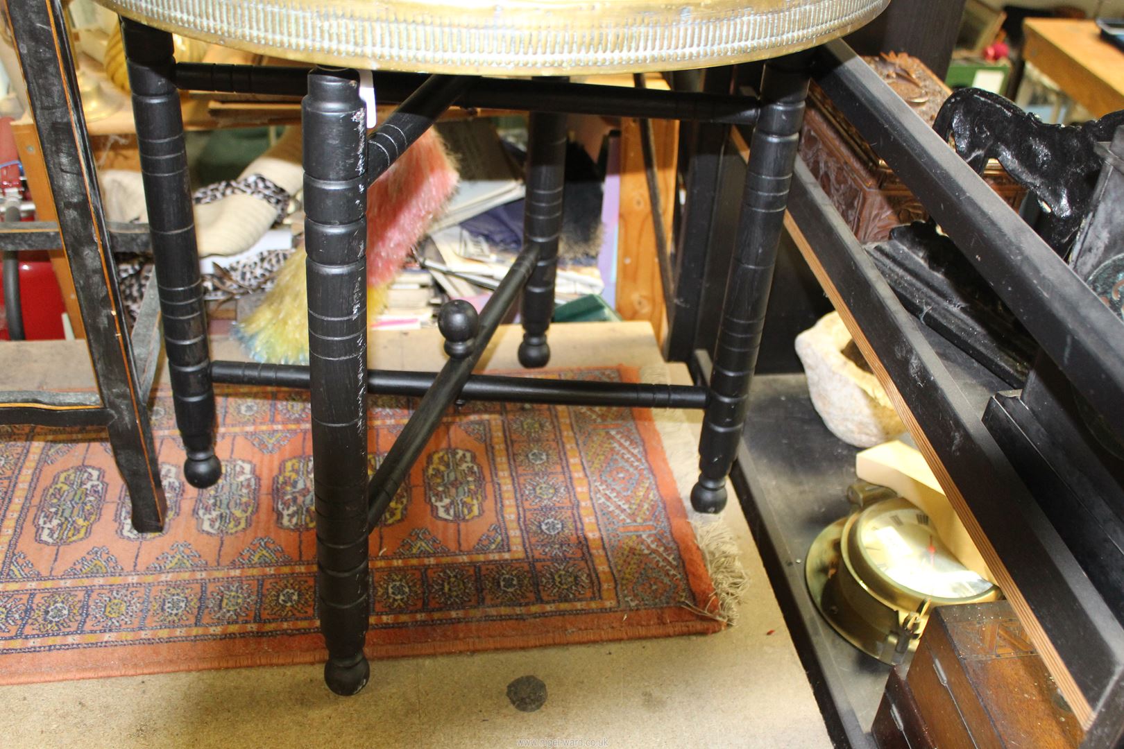 An early 20th century Benares brass top table with hammered design, on folding wooden base, - Image 3 of 3