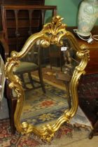 A large modern gilt type finish framed wall hanging mirror, 38 1/2" x 24 1/2" approx.