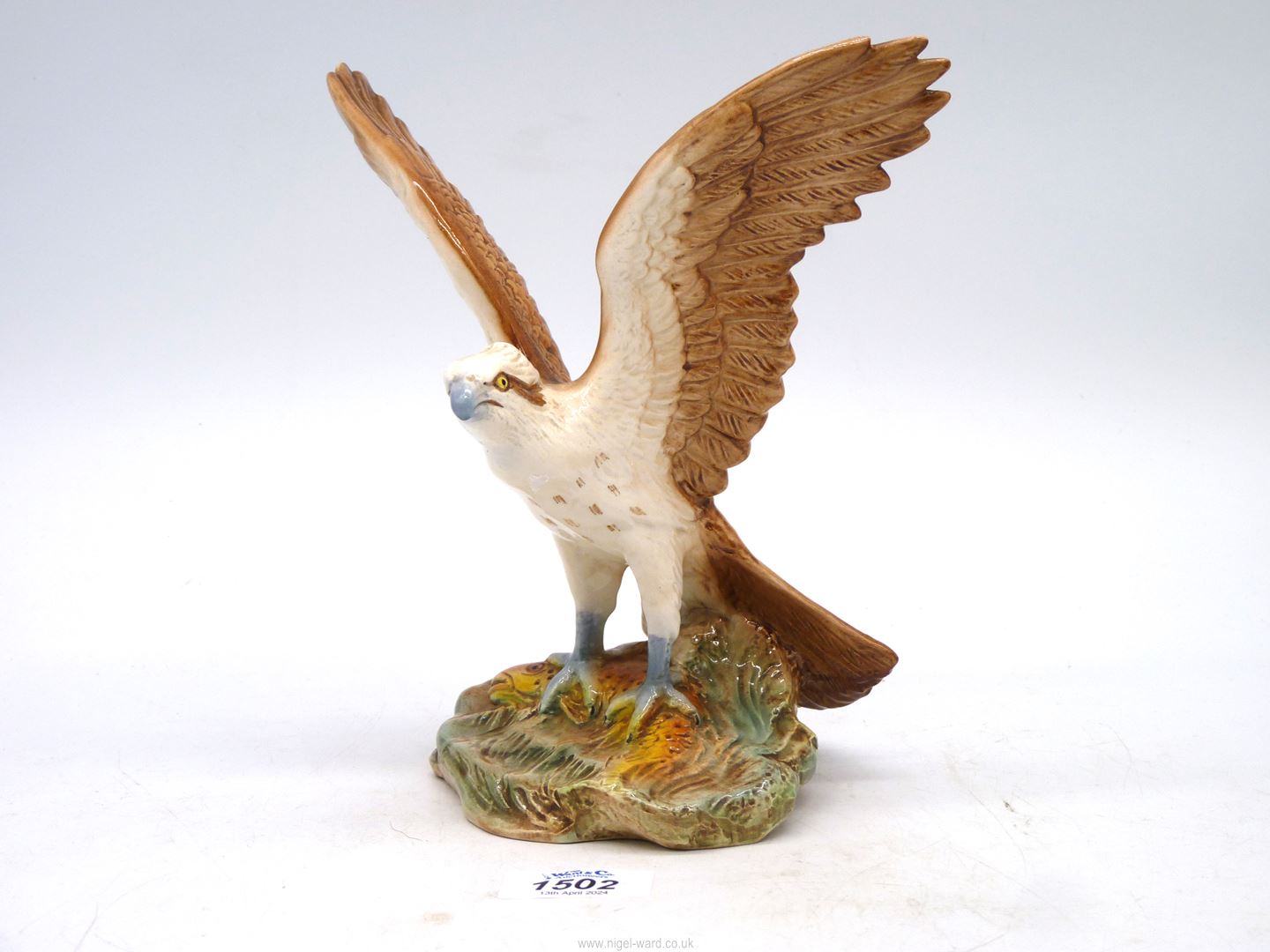 A Sylvac hand-painted figure of an Osprey, 8 1/4" tall.