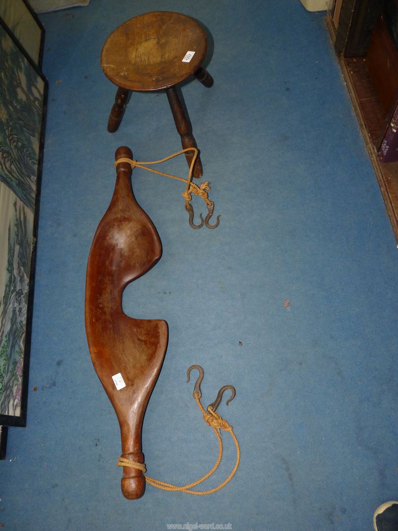 A milking stool and a wooden Yoke, 37 1/2" long.