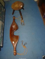 A milking stool and a wooden Yoke, 37 1/2" long.