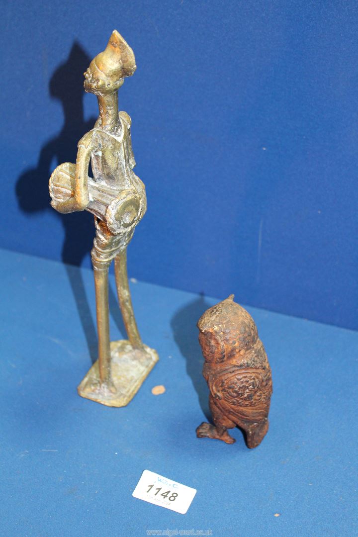 A small heavy cast metal model of an Owl and a brass figure of a tribesman beating a drum. - Image 3 of 3