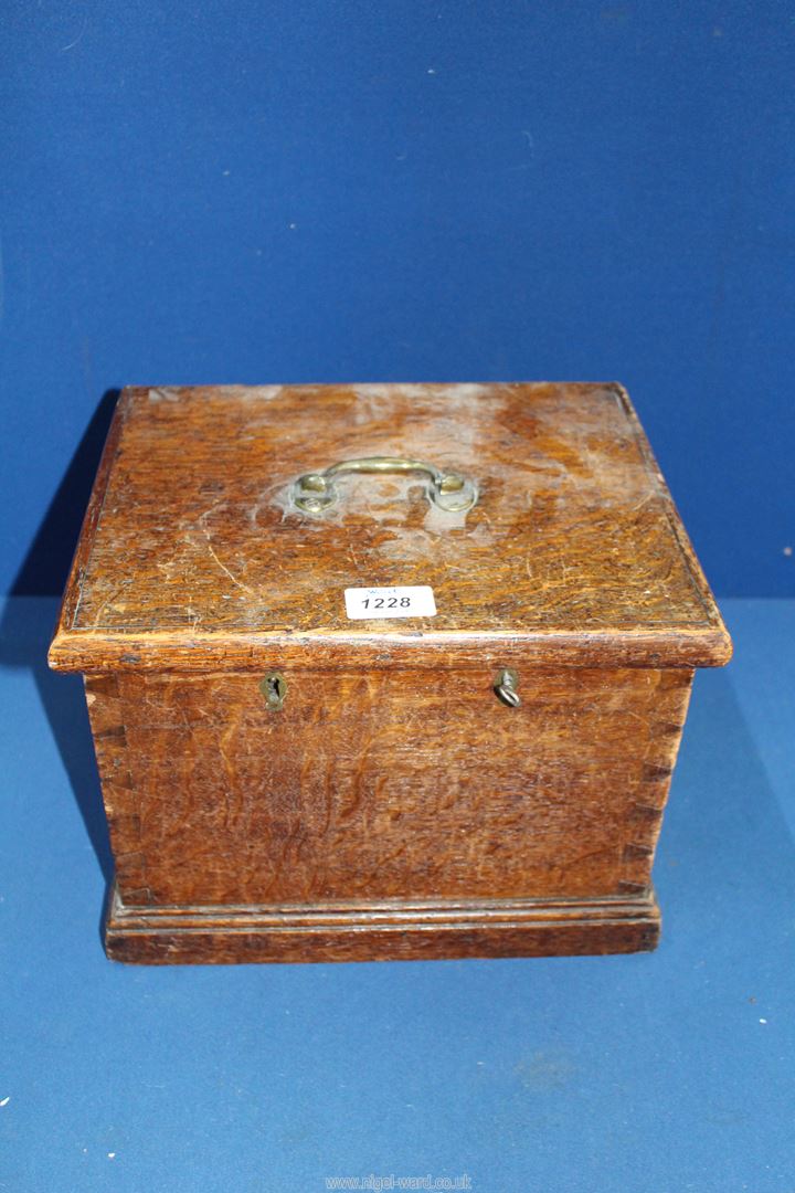 An Oak Box having hinged lid with two lift-out double sectioned compartments with two locks and one