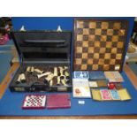 A quantity of games including; Chess board having pottery tiles and pieces (incomplete a/f),