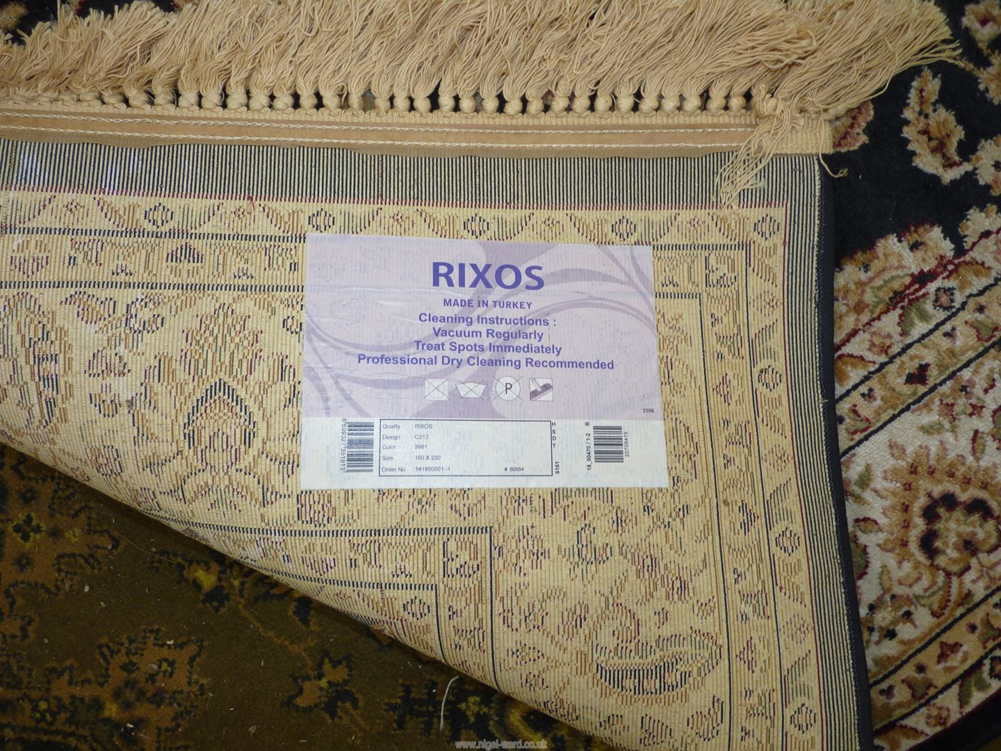 A large Rixos Turkish rug cream stylised flowers on black ground and floral border, - Image 3 of 3