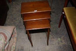 A Nest of three Mahogany rectangular occasional Tables, the largest 19 1/2'' x 12 7/8'' x 20'' high,