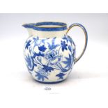 A large Wedgwood blue & white floral jug with gilt rim [damage to handle] 8" tall.