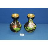 A pair of 20th century black Cloisonne baluster vases with Chrysanthemum decoration, 6" tall.