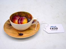 A Royal Worcester miniature cup and saucer, decorated with peach, apple and blackberries, signed W.