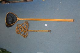 A pool net and a carpet beater.