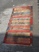 A hearth rug by Shalamar in geometric pattern, orange, blue and yellow, 53 1/2" x 27 1/2".
