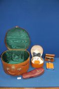 A vanity case with green lining, collar and stud box and contents, Selfridges travel slippers,