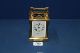 A Brass Carriage Clock by Garrard & Co, 112 Regent Street W1, with key.