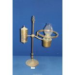 A heavy brass Student Oil lamp with a weighted base, 20" tall.