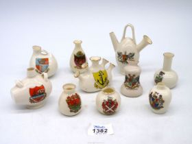 A small quantity of crested ware to include "model of Flemish bottle Ostende Museum'', Birmingham,