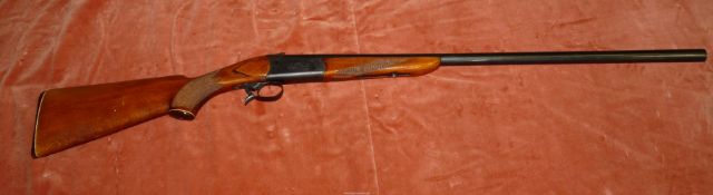 A 12 bore Baikal Model IJ 18 single barrel Shotgun with chequered pistol-grip stock and fore-end,