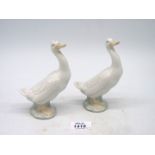 A pair of white Nao ducks, 6" tall.