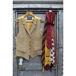 A Gieves & Hawkes camel coloured waistcoat with gold lining plus a small quantity of ties,
