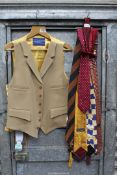 A Gieves & Hawkes camel coloured waistcoat with gold lining plus a small quantity of ties,