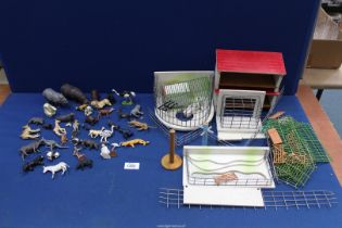 A quantity of mostly Britains zoo animals and hand-made zoo buildings (a/f).