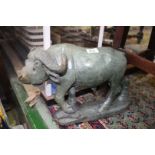 A carved green stone figure of a Buffalo, signed Zacharia Runyanga, 17" x 10 1/2".