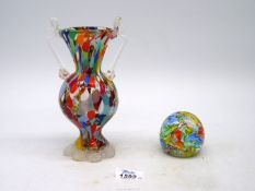 A Murano two handled multi coloured Vase with random murrines among colour patches and standing on