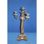 A heavy bronze metal four light Candelabrum having a tapering reeded column, swept sconce supports,