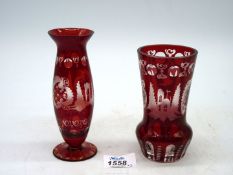 A 19th century Bohemian ruby red deep cut vase decorated with castle and bird, 5" tall,