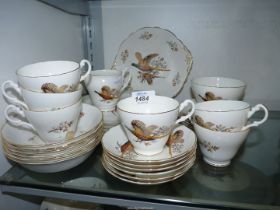 A six setting Royal Stuart 'Pheasant' dinner and tea service including; cups, saucers, bowls,