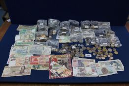 A box of Foreign coins and notes including; Europe, Asia, South America, Middle East, etc.