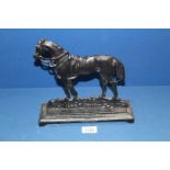 A black cast metal doorstop in the form of a horse, 9 1/4" high.
