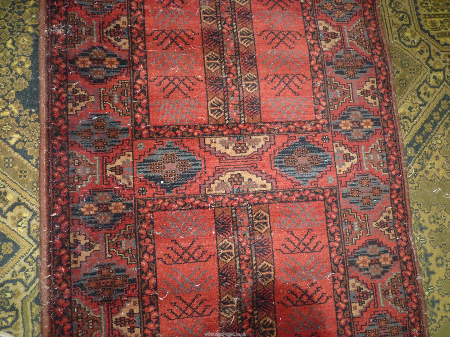 A Louis de Poortere Massoni carpet in earthy tones having a border pattern of small guls and two - Image 2 of 3