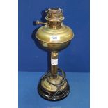 A brass oil lamp, partly converted to electric having an Art Nouveau base, 18" tall.