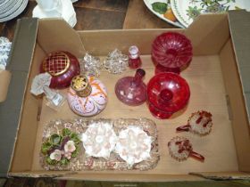 A quantity of coloured glass including Cranberry rose bowl and perfume bottles, red candle stands,