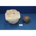 A heavy stone hewn mortar and a cannon ball, 3'' diameter approx.